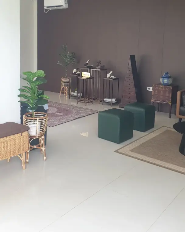 Lounge corner with plants and armchairs