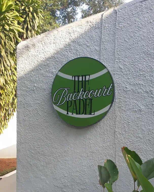 The Backcourt logo on a white wall